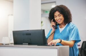 Nurse,,Phone,Call,And,Tablet,Of,Black,Woman,At,Hospital