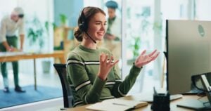 Happy,,Woman,And,Headset,With,Computer,In,Call,Centre,Of
